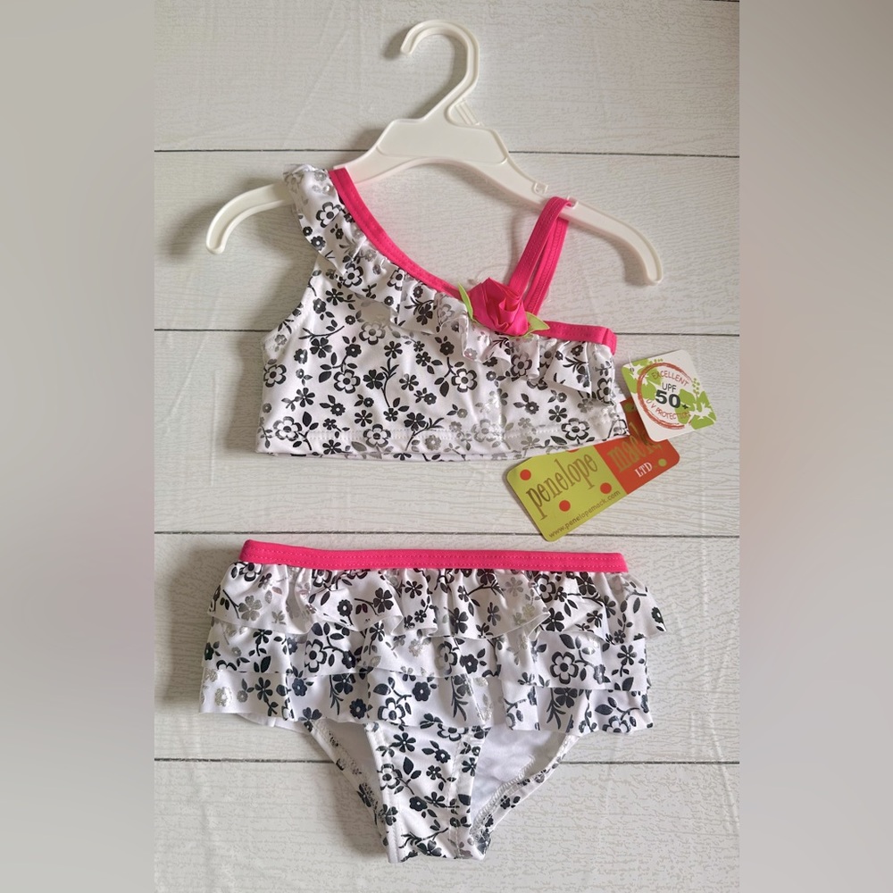 NWT Penelope Mack 2-piece bathing suit
girls 2T. Spf 50